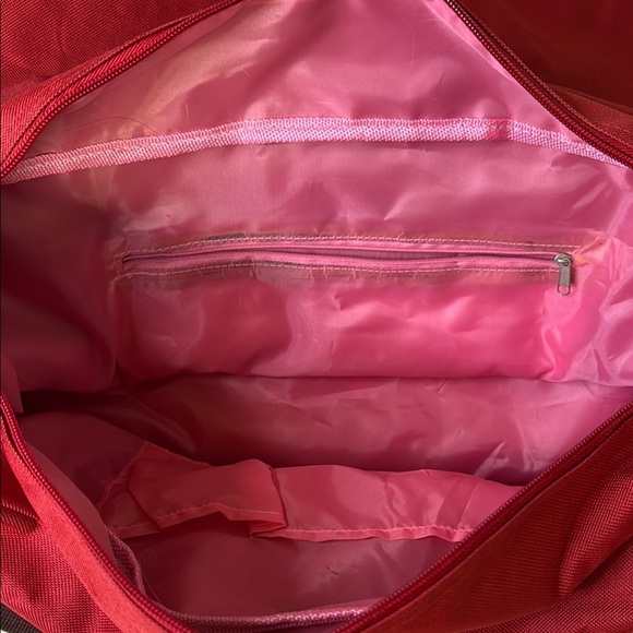 Red and Brown Travel Bag with Adjustable Strap and Sturdy Design - Picture 7 of 10